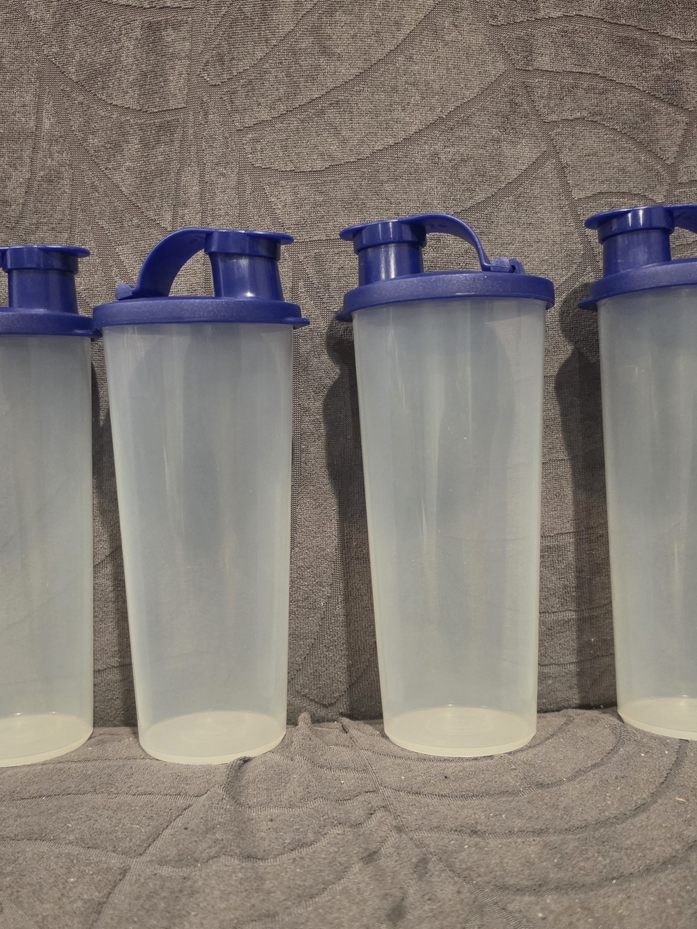 Tupperware Clear Tumbler Bottles with Blue Flip Lids - Set of 4